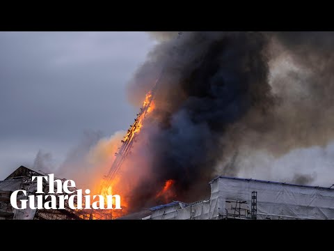 Moment spire collapses at Copenhagen's old stock exchange